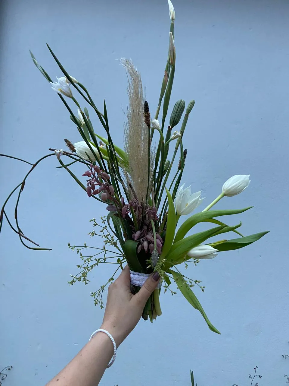 White tulips, pampas grass and native greenery